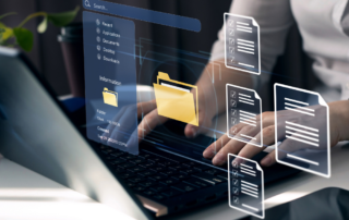 A professional working on a laptop with holographic icons displaying folders and documents, emphasizing a streamlined and efficient digital workflow. This visually represents the importance of document management systems in organizing, storing, and accessing files securely and efficiently.